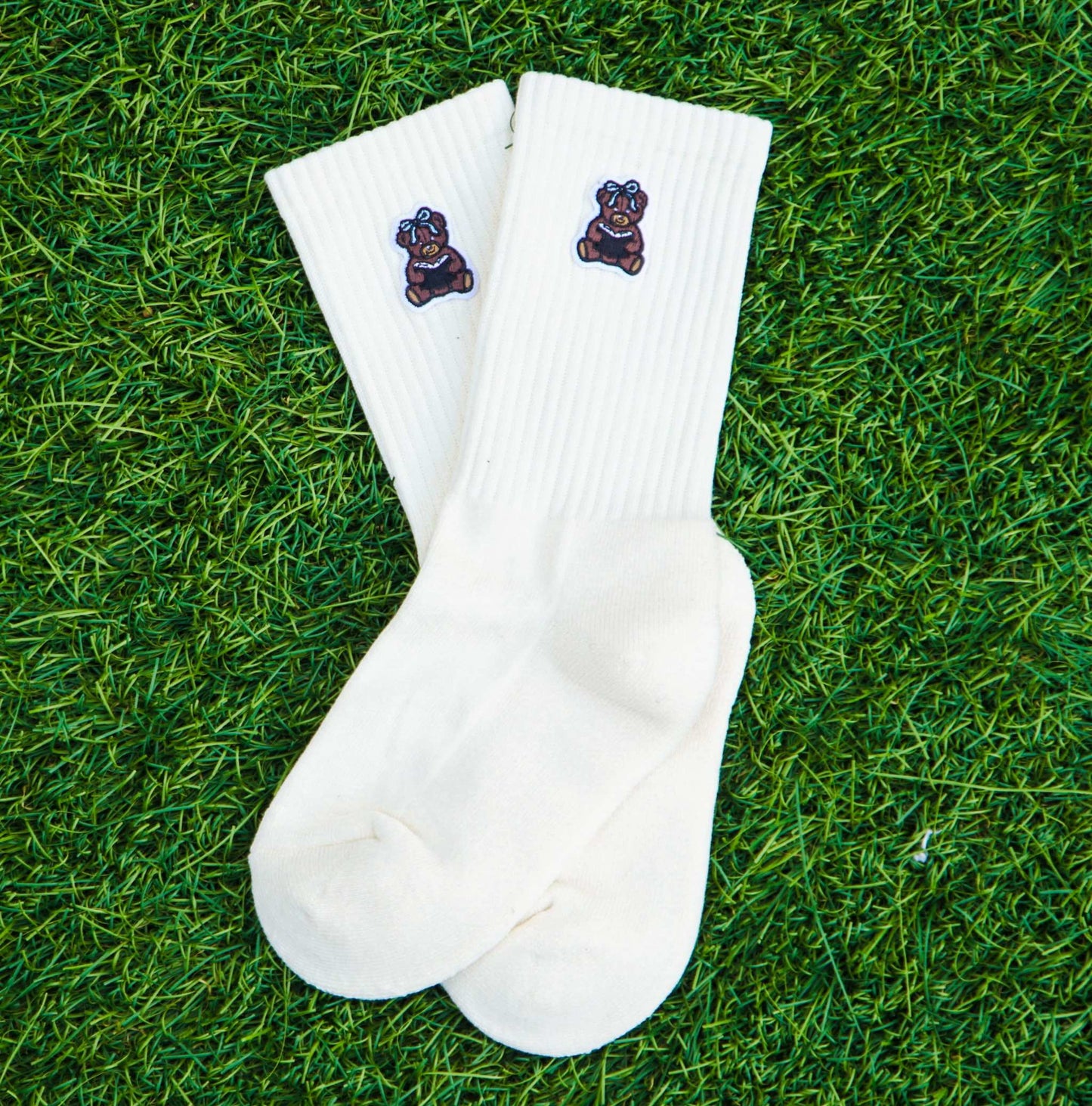 Ivory crew socks with embroidered bear patches on ribbed cuffs, soft and cushioned Book Bear Socks for comfort and breathability