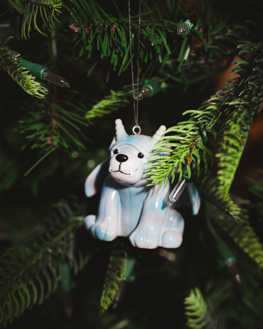 Bartholomew Gargoyle Ornament in glossy gray resin with pale blue accents, black facial details, and silver hanging loop. Officially licensed Rachel Gillig merch.