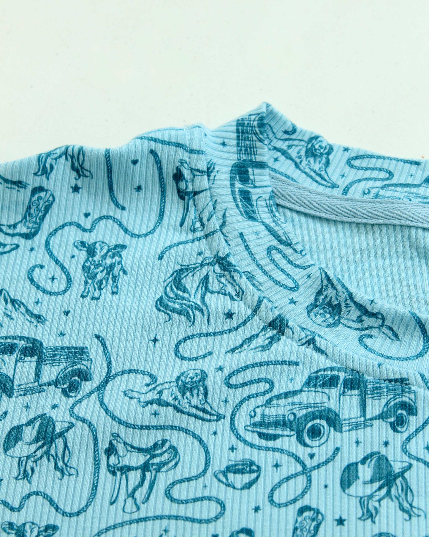 The Rebel Blue Ranch Lounge Set from Next Chapter is officially licensed by Lyla Sage, the author of the cowboy romance book series. Cozy bookish pajamas and sleepwear. Bookish loungewear for readers.