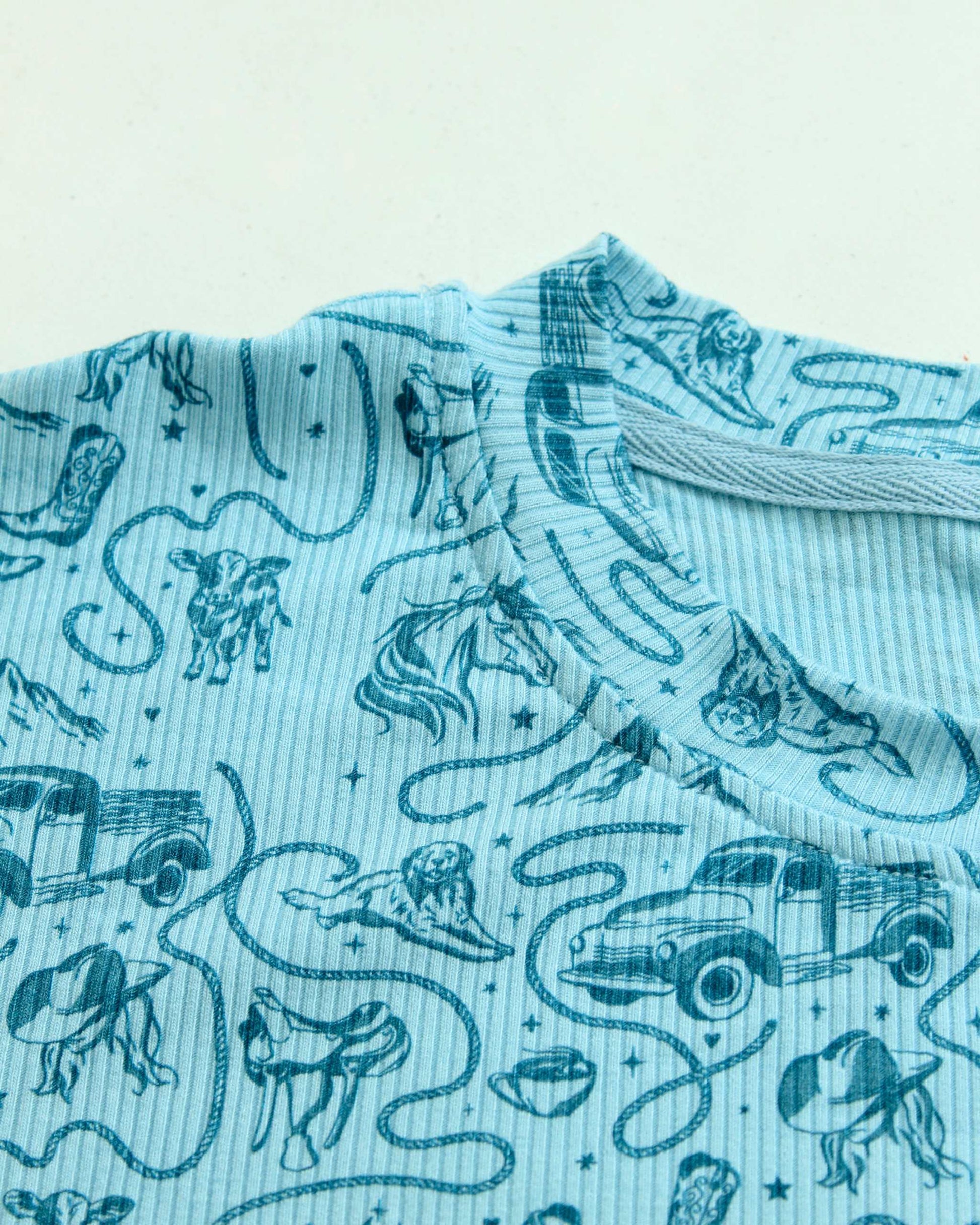 The Rebel Blue Ranch Lounge Set from Next Chapter is officially licensed by Lyla Sage, the author of the cowboy romance book series. Cozy bookish pajamas and sleepwear. Bookish loungewear for readers.