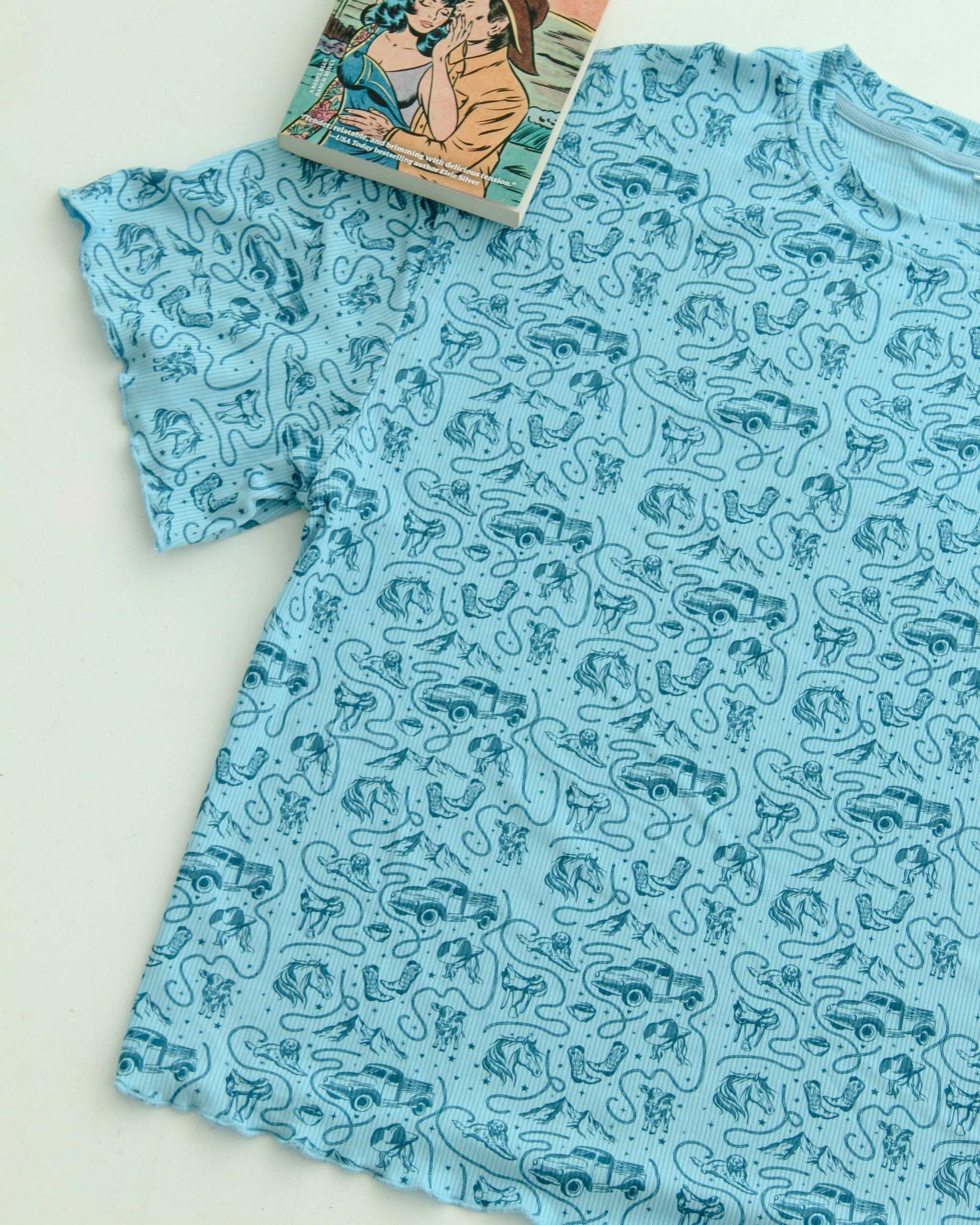The Rebel Blue Ranch Lounge Set from Next Chapter is officially licensed by Lyla Sage, the author of the cowboy romance book series. Cozy bookish pajamas and sleepwear. Bookish loungewear for readers.