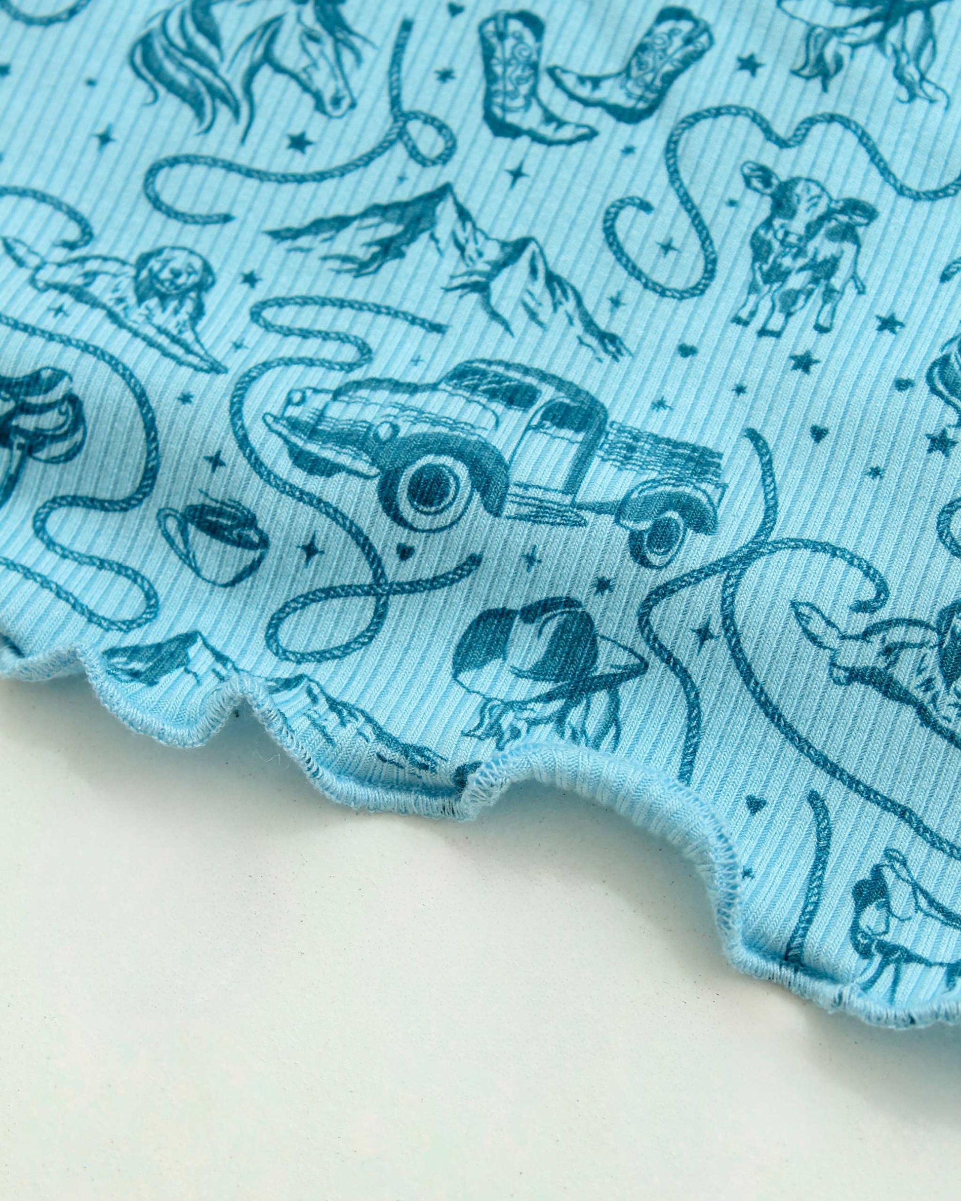 The Rebel Blue Ranch Lounge Set from Next Chapter is officially licensed by Lyla Sage, the author of the cowboy romance book series. Cozy bookish pajamas and sleepwear. Bookish loungewear for readers.