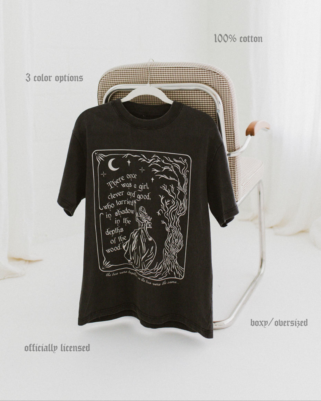 The One Dark Window Tee from Next Chapter is officially licensed by Rachel Gillig and inspired by the Shepherd King Duology. Next Chapter is an official retailer of Rachel Gillig licensed merchandise. This image shows the One Dark Window Tee in the vintage black color option.