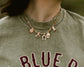 Cowboy romance bookish charm necklace inspired by the Rebel Blue Ranch series by Lyla Sage. 