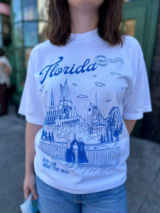 Florida Wizarding Parks Tee. A person at the Wizarding World of Harry Potter wears a t-shirt that depicts theme park. The t-shirt also references Taylor Swift's song "Florida!!!"