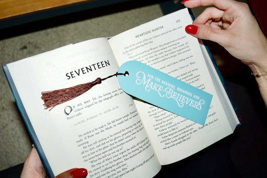 Mint and white Next Chapter Bookmark with brown tassel on an open book page labeled Seventeen