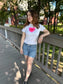 main character graphic gradient heart 90s baby tee