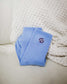 The Next Chapter Crew Socks are shown in the blue color option. Cozy bookish socks for the readers. 