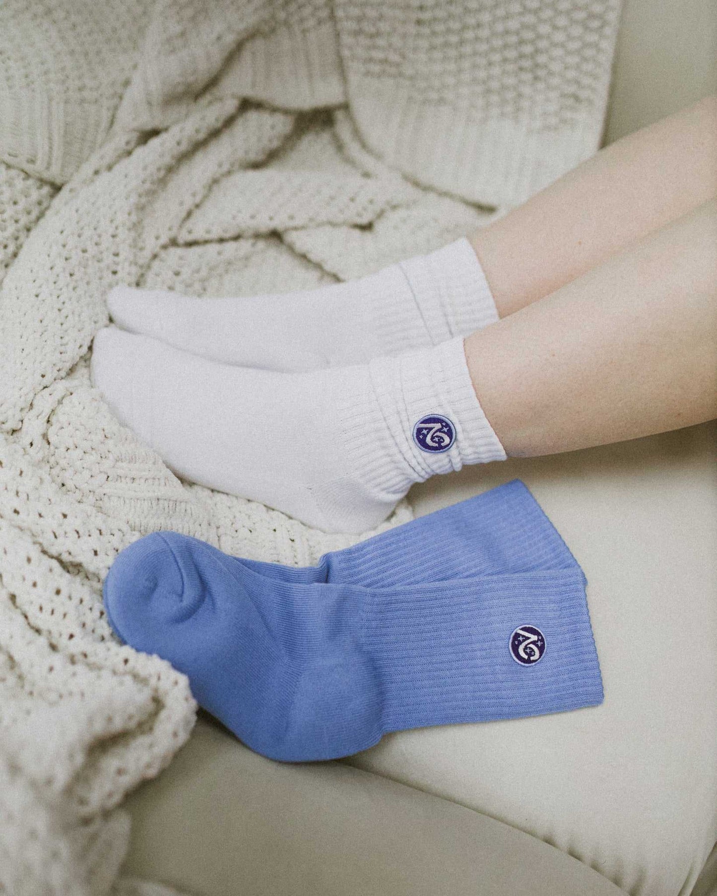 The Next Chapter Crew Socks are shown in two color options. Cozy bookish socks for the readers. 