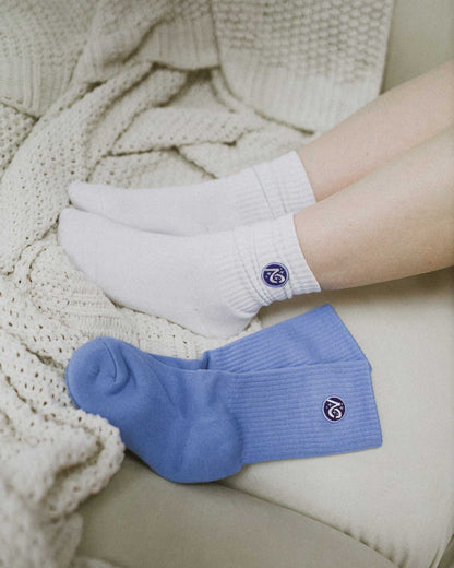 The Next Chapter Crew Socks are shown in two color options. Cozy bookish socks for the readers. 