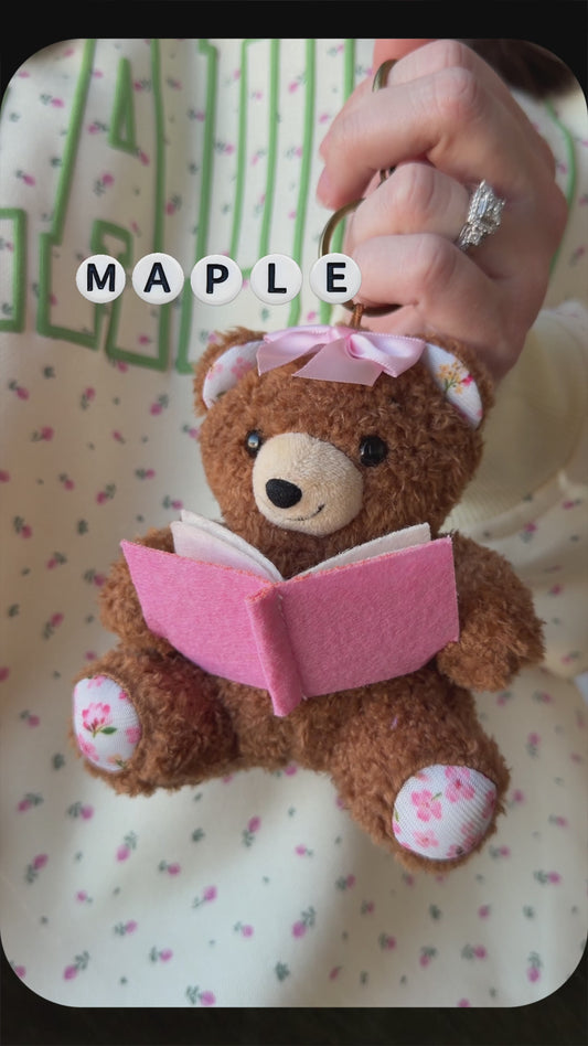 Book Bear Plushie Bag Charm from Next Chapter named 'Maple' Next Chapter offers unique and high quality book merch and apparel for readers.