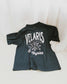 Velaris Valkyries tee featuring a deep navy fabric and white, screen printed design. From A Court of Silver Flames. Officially licensed by Sarah J. Maas. 